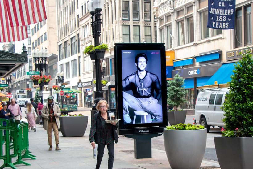 Digital street-furniture screen in a shopping district